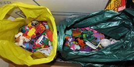 In these bags are a host or two of the Fisher-Price people, animals, etc.  No doubt there are a number of other brands, but there is quite a collection in these two bags.