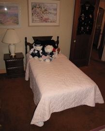 There is a twin bedframe headboard and matching nightstand offered in the sale. 