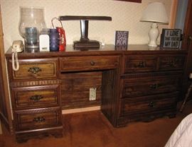 These are actually two matching pieces, sitting side-by-side.  The left piece is a vanity desk (sorry, no mirror), while the right half is a four-drawer dresser.