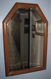 A very nice mirror, hanging in one of the bedrooms.