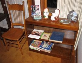 The other of the matching bookcases.  Also a wooden chair.  