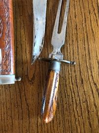 Oriental carved knife and fork set