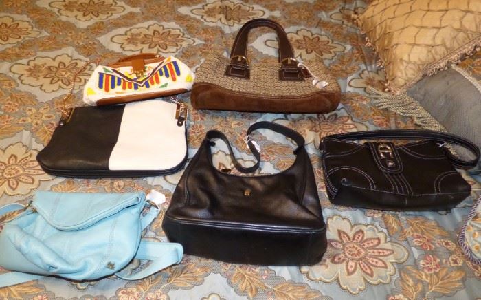 A sampling of designer purses : Aigner, Coach, Sak, Etc