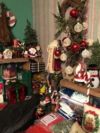 A room full of Christmas holiday decorations and decor.