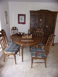 One dining set, table and 6 chairs, large hutch to match