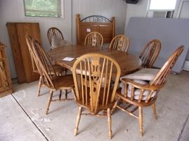 One oak double pedestal with 6 oak side chairs and 2 captains chairs, 2 18 inch leaves,