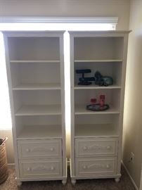 2 beige bookcases
