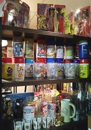 Assorted Beer glasses ....Assorted collectible thermoses....Giraffes....Action figures