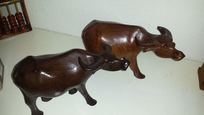 Carved wooden water buffaloes
