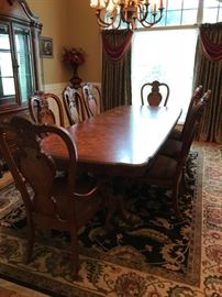 #1 Standard furniture dining table w 1 leaf and 10 chairs 88-108x43x29 $1,500.00
