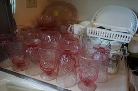 Large collection of matching pink glass