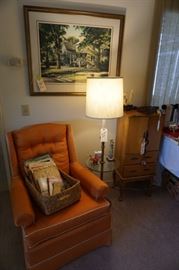 Orange silk upholstered chair with white piping....immaculate