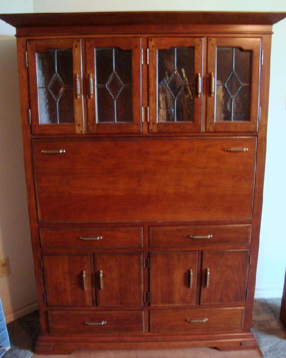 Bookkeepers Desk by Pennsylvania House.  Leaded Glass Doors, Drop front Desk.  Original price was 4500.00.  Owners paid 1979.50