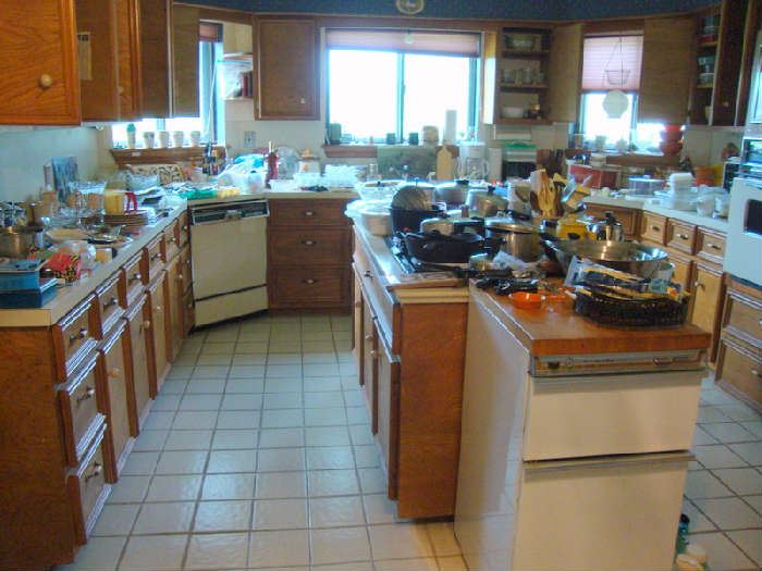 Lots of Kitchenware, Pots, Pans, Tupperware, glassware, flatware, utensils, etc.   Kitchenaid Trash Compactor 