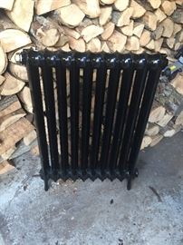 antique cast iron radiator painted black
