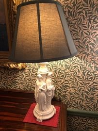 one of a pair of antique parian lamps