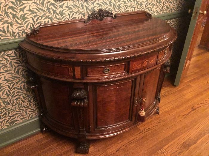 Antique demi-lune commode with inlaid decoration and carvings