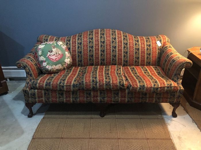 antique camel back sofa with striped upholstery