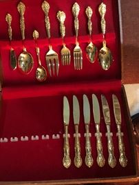 incomplete set of silver-plated  flatware with gold-plated accents