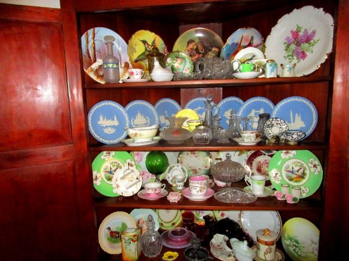 Corner cabinet full of collectible ceramics: Limoges , Wedgwood, De Havilland an more