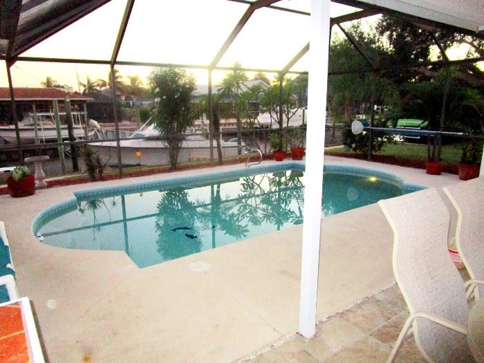 This canal front pool home with private dock just 4 miles from Sebastian Inlet is also for sale