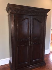 gorgeous tall armoire with mirrors on the inside of the doors