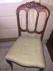 several small carved chairs