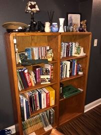 Solid wood bookcase with a great selection of books and collectibles