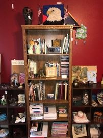 Selection of books and collectibles, including a Mosaic Eagle and framed flag