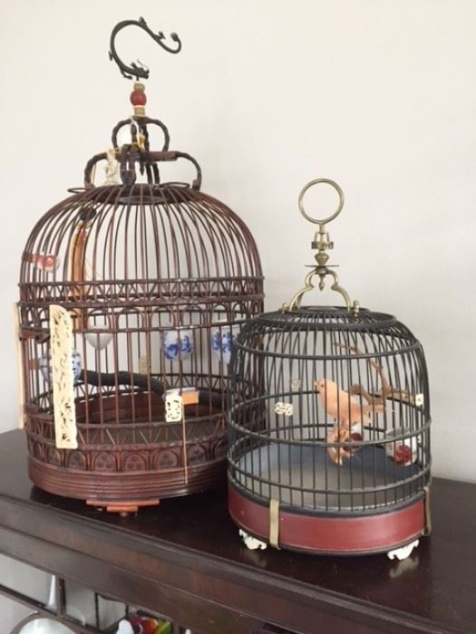 Vintage and/or antique Chinese wooden bird cages with amazing original accessories.  