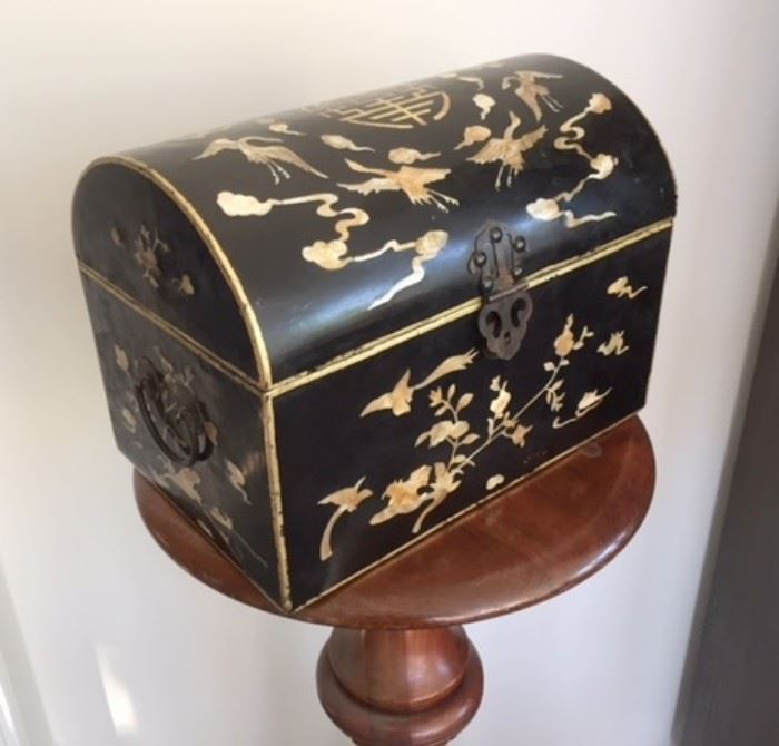 Black lacquer box with mother of pearl inlays with stylized bird, cloud, and flower motifs flanking a central "shou" or longevity motif. Date unknown; probably 20th century. 
