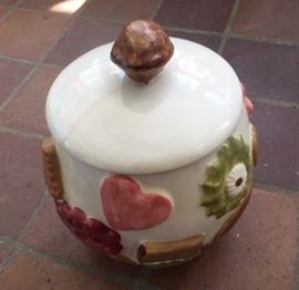 Vintage ceramic cookie jar with colorful 3-d motifs. Inscribed "Los Angeles Potteries, Made in USA" on bottom, along with "c 56." Lid has a long crack in it, lovingly repaired. This was hidden from view for decades. Until just a few weeks ago, it sat at the back of a high shelf in the butler's pantry. 