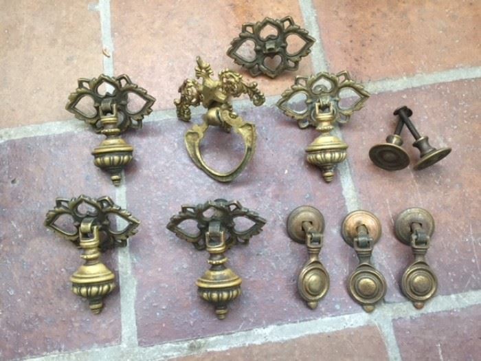 Set of 11 antique brass door knockers.  Sold as a set only. 