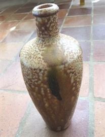 Hand built ceramic jar with speckled glaze in shades of taupe, sienna, and coffee.  Bottom is stamped "Campos, Filhoa, Aveiro Portugal. Date unknown.