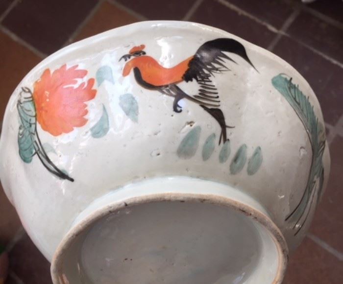 Antique Chinese ceramic bowl with celadon glaze and painted motifs depicting a rooster and chrysanthemum flower. In the past, this combination of motifs in Chinese art creates a rebus (or pictorial pun) communicating  a wish for high social status. The opposite side of the bowl bears a 4-character inscription in running script. Some age; date unknown. 