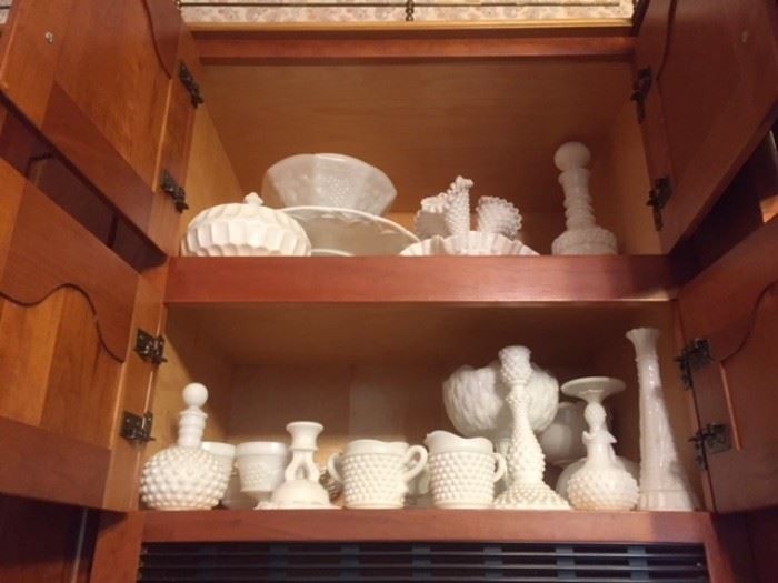 A fair amount of vinage white hobnail glass bowls, vases, cups, candlesticks, etc. 