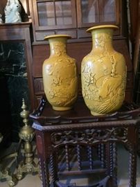 Chinese yellow carvedf porcelain vases in the dining room, with 4-character seals on bottom. 