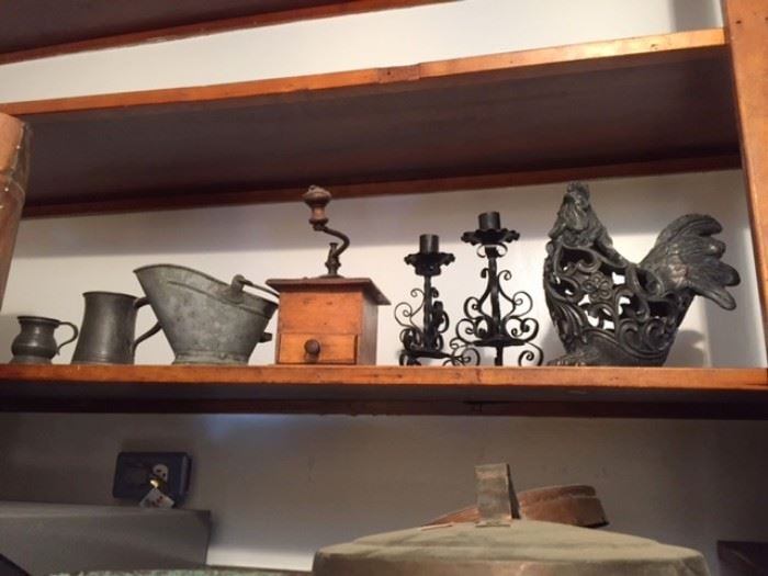 Wooden spice or coffee grinder, pewter mugs, metal candlesticks and rooster, from our kitchen department.