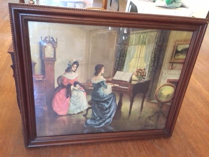Framed print showing a Victorian parlor scene with ladies playing a spinet, signed "Frederic Mizen," an American artist (188-1964). 