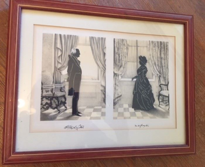 Framed print depicting George and Martha Washington in silhouette.