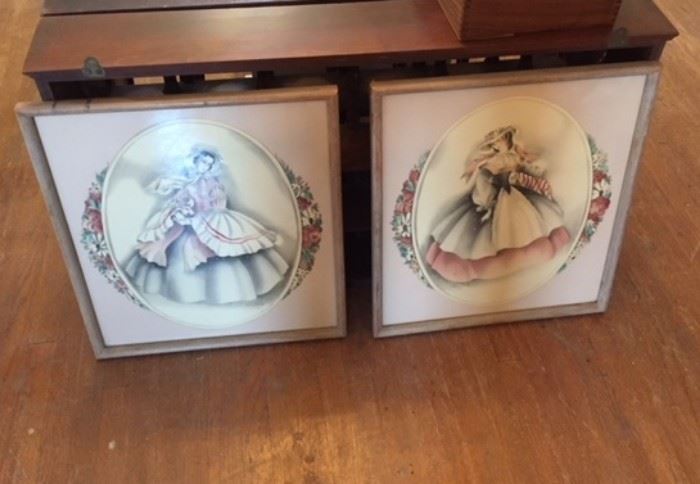 Framed prints of elegant ladies.
