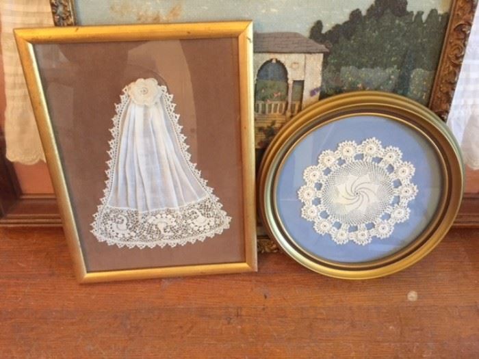 Framed lace doily and handkerchief.
