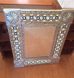 Aluminum and decorative tile mirror from some exotic locale.