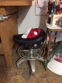 A  stool that Santa might love. It's an adjustable bar stool made of chrome and vinyl. The seat resembles the seat of a Harley Davidson motorcycle. From our Christmas department in the third floor ballroom.