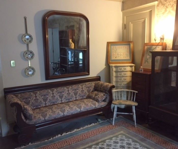 Vintage sofa, emroideries, mirror, and display case in the second floor master bedroom sitting room. 