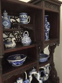 Chinese blue & white porclains, housed in a Chinese (?) carved wood display case. In the first floor living room. 