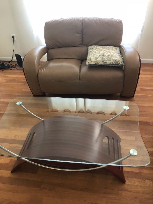 Leather furniture and glass top coffee table