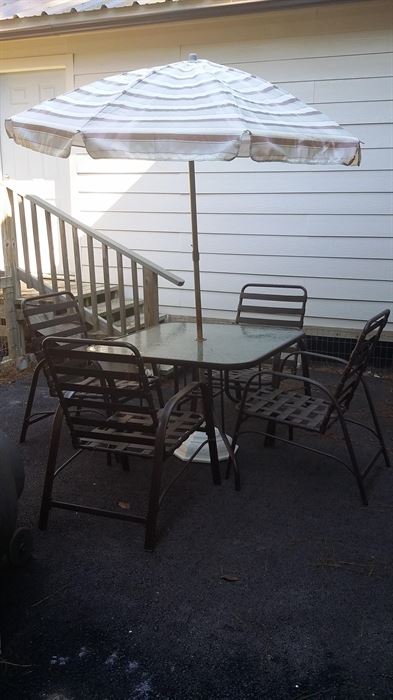 Table and 4 chairs, umbrella -$55.00