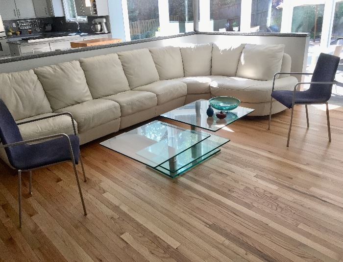 Natuzzi leather sectional and Ligne Roset chairs