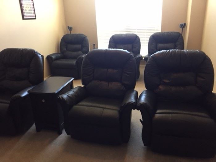 6 black leather recliners in movie room.  Some never used. $150.00 each 
